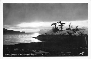 Rock Island Alaska~Sunset Over Water~Trees Growing by Rocks in Front~1947 RPPC