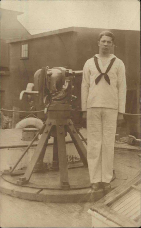 US Navy Sailor Poses Beside Cannon Gun c1910 Real Photo Postcard