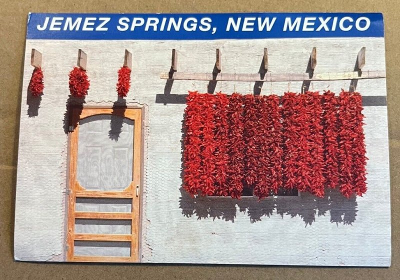 UNUSED POSTCARD - CHILI RISTRAS DRYING, JEMEZ SPRINGS, NEW MEXICO