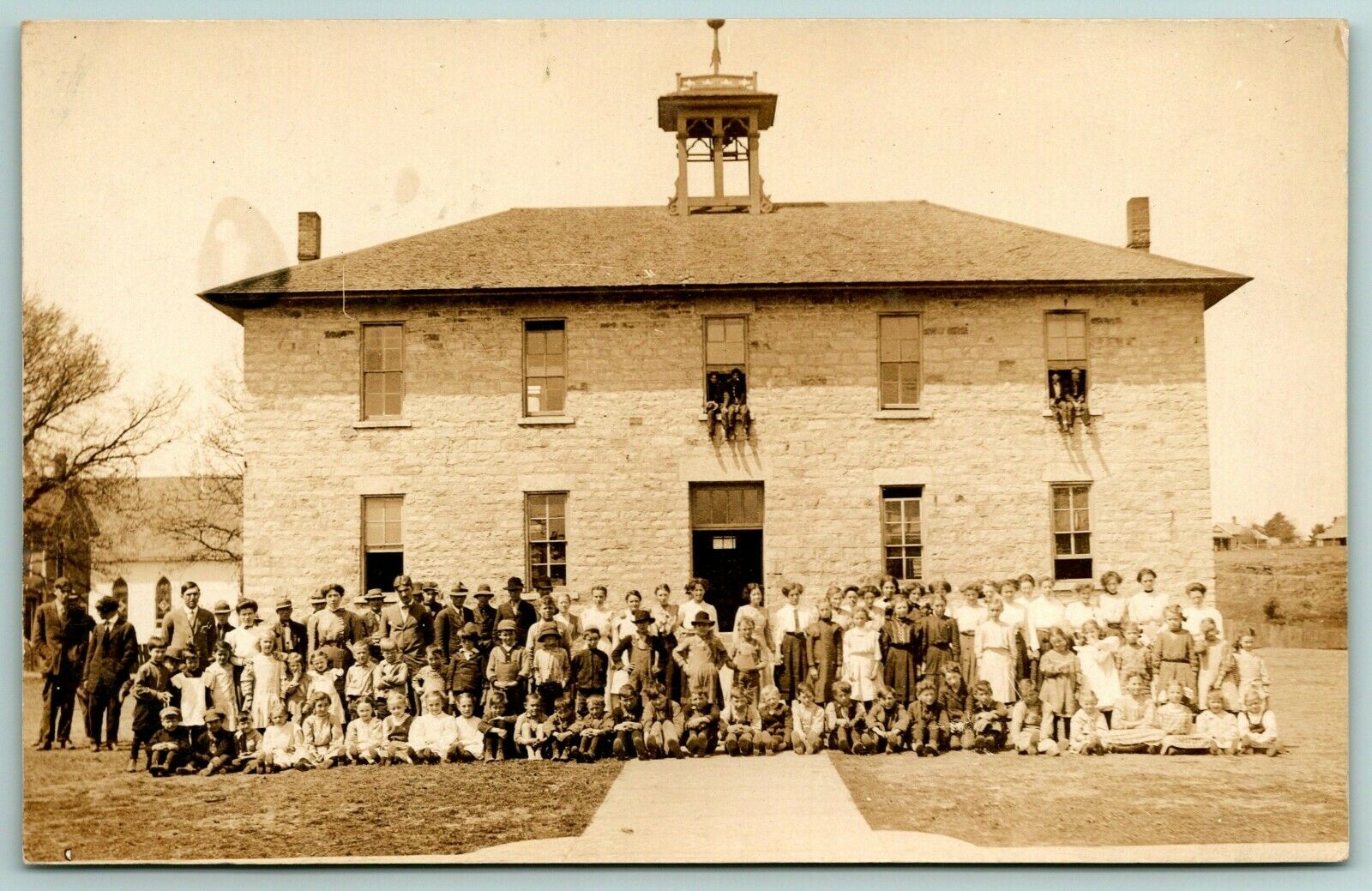 Volga City IA4 Boys Sit Ledge of 2ndStory Windows For School Pics