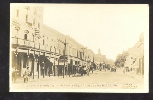 RPPC HIGGINSVILLE MISSOURI DOWNTOWN MAIN STREET SCENE REAL PHOTO POSTCARD MO.