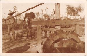 HORSE TURNING WHEELED EQUIPMENT- POSSIBLY MINING RELATED REAL PHOTO POSTCARD