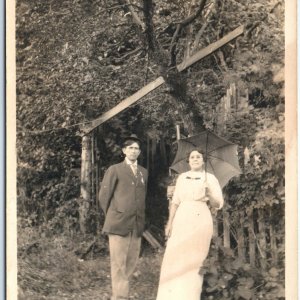 ID'd c1910s Outdoors Couple RPPC Woman w/ Umbrella Summer Real Photo Scott A125