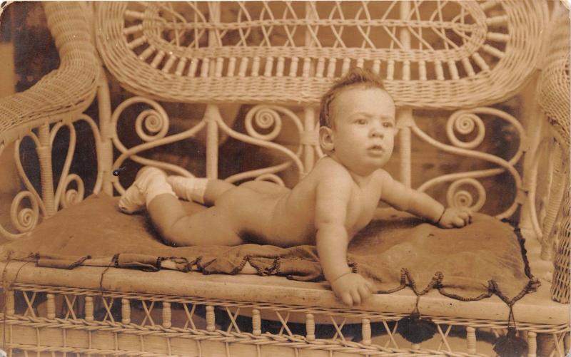 NAKED BABY ON WICKER SETTEE~SEPIA REAL PHOTO POSTCARD 1922