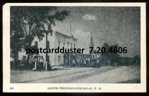 h3044 - ST. VERONIQUE Quebec Postcard 1950s Street View. Gas Pumps