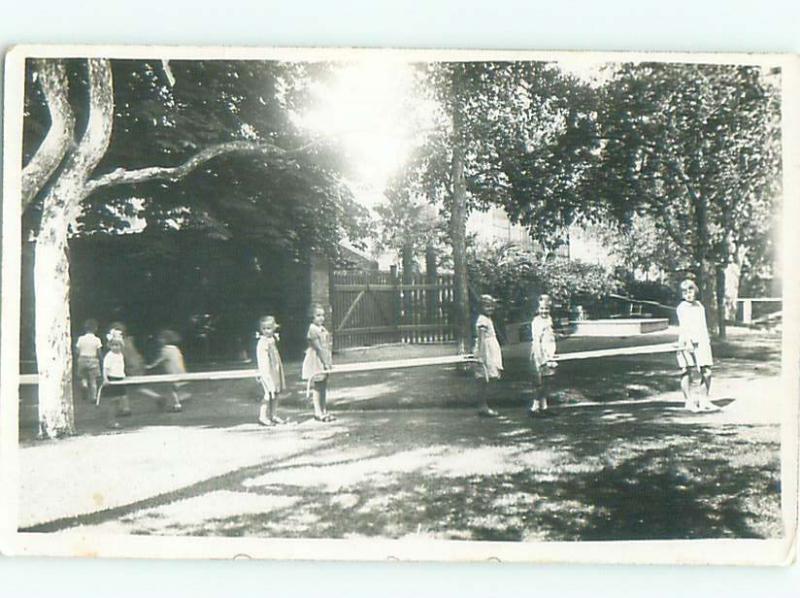 rppc 1930's KIDS MOVING LONG BENCHES AC8768