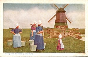 Netherlands Volendam Terug van de weide Windmill and Locals In Traditional Co...