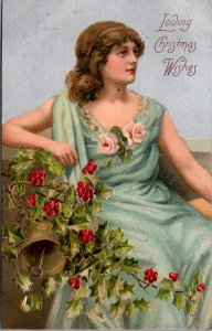 Postcard Christmas   Edwardian woman sitty with bells and holly