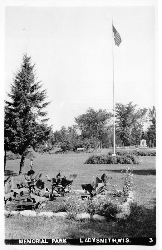 Ladysmith Wisconsin~Memorial Park~Monument~Old Glory Flying~Garden~Vintage RPPC