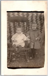 Two Kids Sibling Girl And Boy Wooden Chair Photograph Postcard