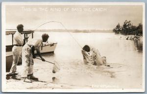 FISHING ANTIQUE EXAGGERATED REAL PHOTO POSTCARD RPPC KIND OF BASS WE CATCH