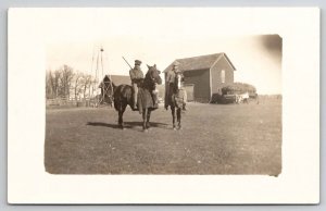 RPPC Two Handsome Men On Horseback With Rifles Dead And Rabbits Postcard S22
