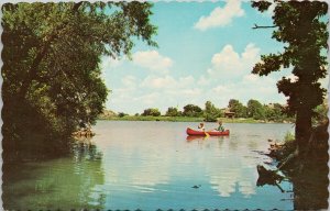 Greetings from Rimbey Alberta Blindman Valley Canoeing Red Canoe Postcard E99