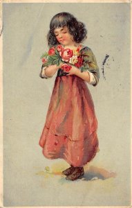 A little girl with a bouquet of flowers PU Unknown