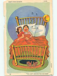 Linen comic WIFE BEING PUSHED OUT OF BED BY SLEEPING HUSBAND k3586