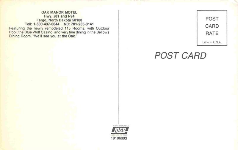 Oak Manor Motel at Night Fargo North Dakota 1970s postcard