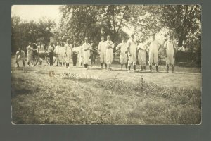 Leigh NEBRASKA RPPC c1910 FIRE DEPARTMENT Firemen HOSE CART RACE nr Columbus