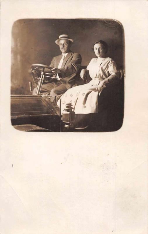 Woman and Man in Car Old Auto Studio Real Photo Antique Postcard J75217