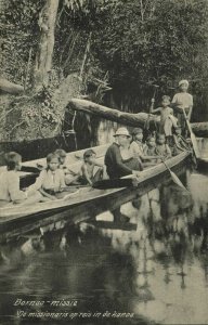 indonesia, BORNEO KALIMANTAN, Missionary with Young Native Boys in Canoe (1910s)