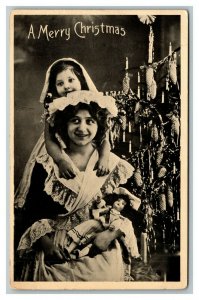 Vintage 1914 Christmas Photo Postcard Cute Girls & Doll by the Xmas Tree