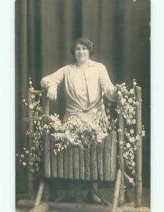 Pre-1934 rppc WOMAN BY WOODEN STUDIO SET WITH FLOWERS Chicago Illinois IL o1749