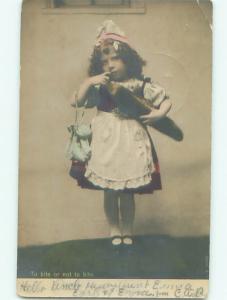 rppc 1908 GIRL WITH HANDBAG PURSE BITES AT HER FINGER AC8249