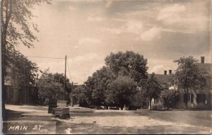 Real Photo Postcard Main Street in Nora Springs, Iowa