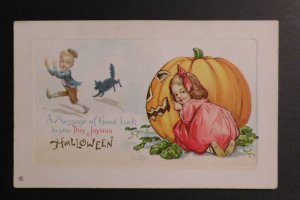 Mint USA Picture Postcard Halloween Children Hiding and Running Carved Pumpkin