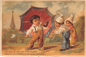 Approx. Size: 3 x 4.25 Two boys a girl and an umbrella  Late 1800's Tradecard...