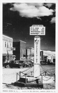RPPC DAWSON CREEK, BC Street Scene Alaska Hi-Way Marker Des Brisay Postcard 1952