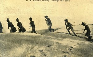 Postcard RPPC View of U.S. Soldiers Hiking Through the Sand.  Z9