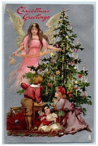 Christmas Greetings Angel And Children Decorate Christmas Tree Tuck's Postcard