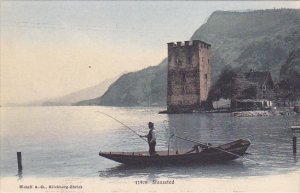 Man Fishing In Stansstad Switzerland