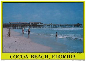 Surfing and swimming by Cocoa Beach Pier, Florida, 50-70s