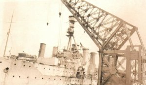 British Royal Navy RPPC Photo HMS Minotaur in Harbor with Crane c.1910s