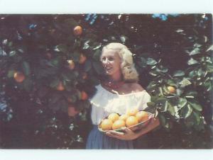 Pre-1980 PRETTY TEXAS GIRL PICKING ORANGES Published In Mcallen Texas TX AD5689