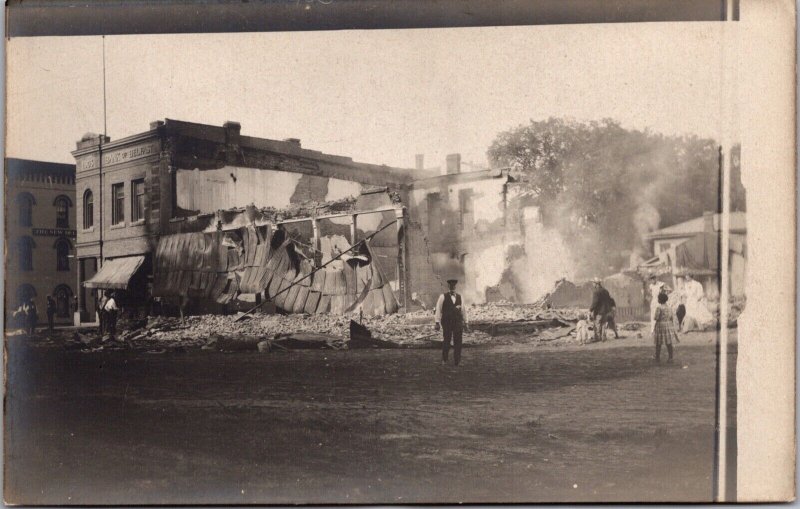 Real Photo Postcard Bank of Belfast and Burned Out Building in Belfast, New York 