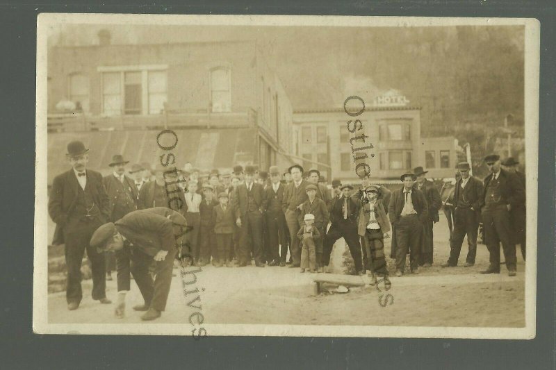 Marquette IOWA RP c1910 ROLLING A PEANUT Down Main Street BET WAGER nr McGregor