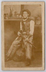 Cowboy in Chaps with Rifle Studio Prop Saloon Scene RPPC Postcard L35