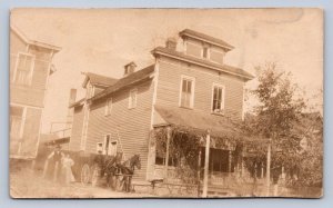 J90/ Jackson Wisconsin RPPC Postcard c1910 Store Delivery Wagon Man 298