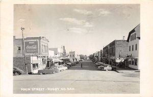 J30/ Rugby North Dakota RPPC Postcard c1950 Main Street Coca-Cola Sign 144