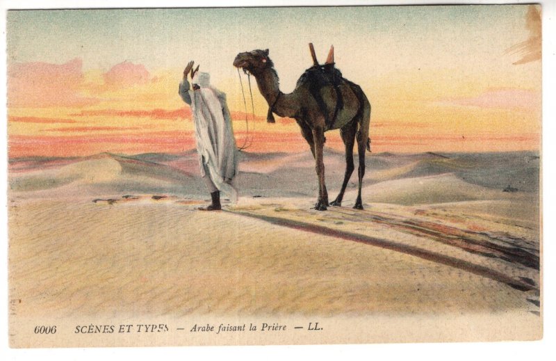 Typical Seen, Arab with Camel in Desert Praying