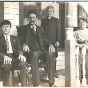 1910s Family on Porch RPPC Real Photo Postcard Handsome Gentleman Boys House A1