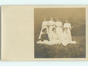 pre-1920's rppc - SEVEN WOMEN ALL WITH THEIR HAIR UP - postcard v1366