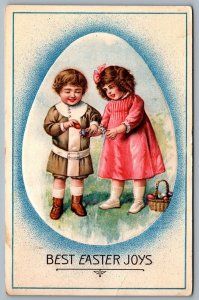 Postcard c1910 Best Easter Joys Kids In Large Egg Frame Embossed