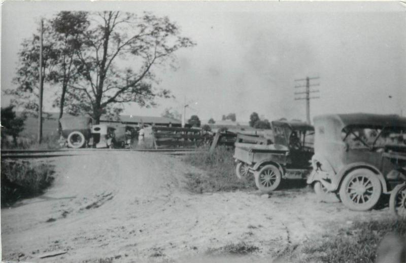 RPPC Old cars Rural Scene Railroad Tracks Ford Model T or smilar cars