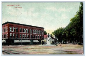 1908 The Square Downtown Dirt Road Lined Trees Statue Bank Rochester NH Postcard 