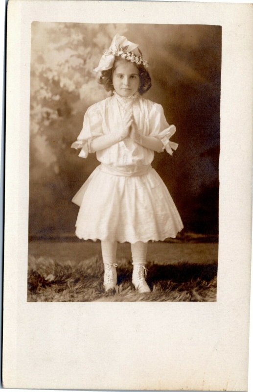 rppc Girl hands praying in white dress, shoes, hat  1904-1918 Rugen Studio RI