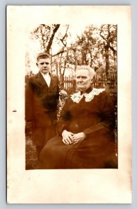 RPPC Grandma Sits with Grandson Standing By AZO 1904-1918 ANTIQUE Postcard 1336