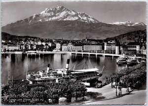 VINTAGE POSTCARD CONTINENTAL SIZE REAL PHOTO OF STEAM SHIP AT LAKE LUCERNE SWISS